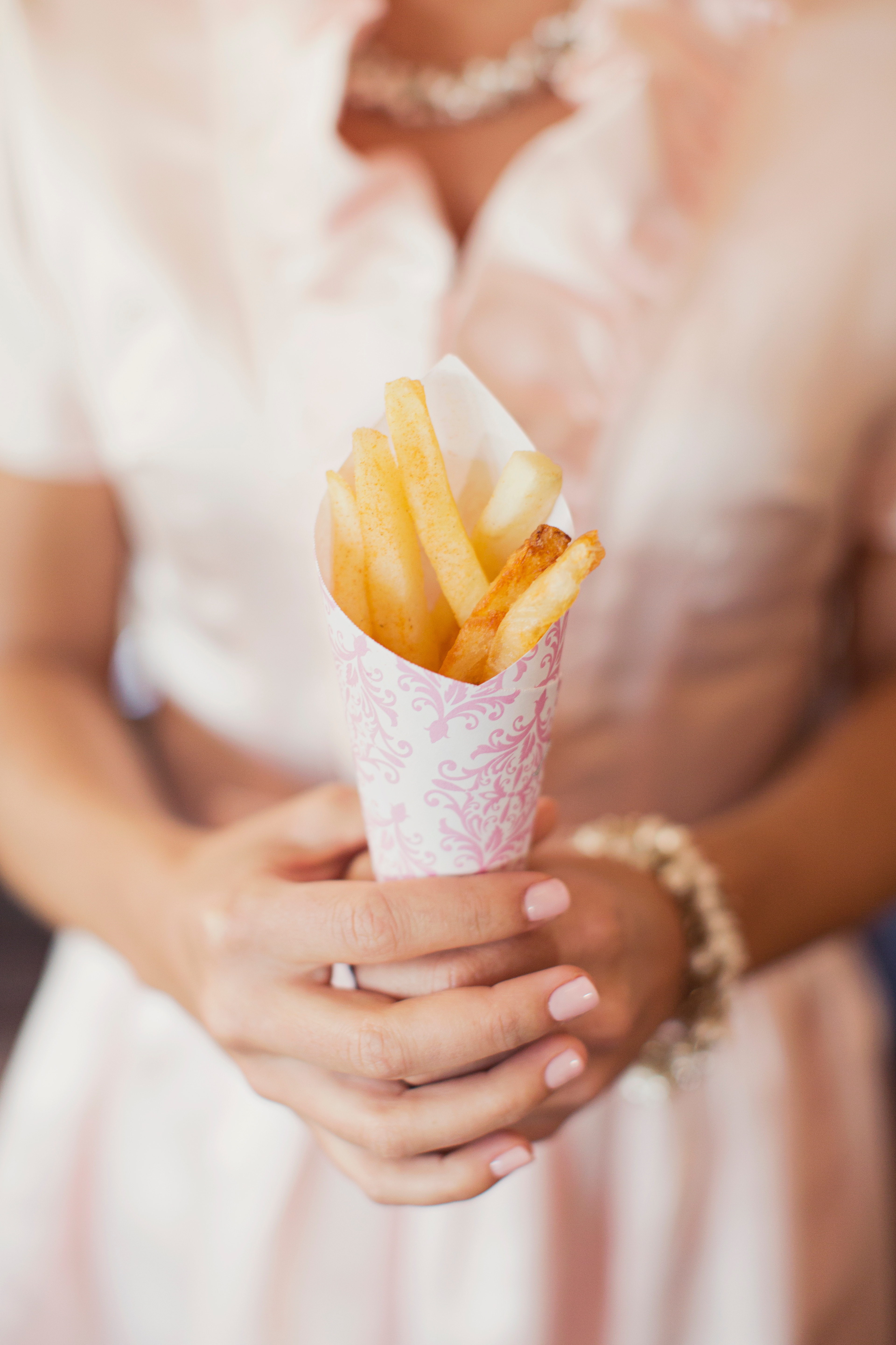 bride holding fries boutique wedding catering