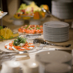 Buffet catering setup with a variety of dishes for a wedding or event.