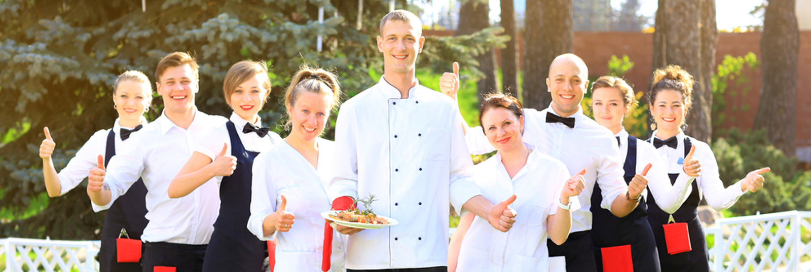 A group of event caterers posing for a picture.