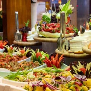 Elegant buffet table with assorted hot entrees and professional setup.