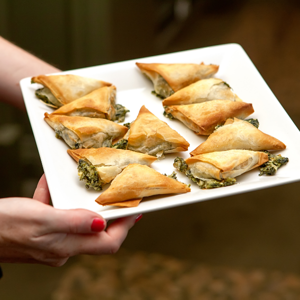Full selection of wedding hors d’oeuvres displayed on serving table