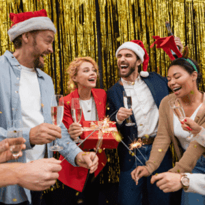 Coworkers laughing and enjoying a well-catered office holiday dinner