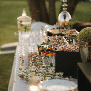 Bride and groom enjoying catered wedding dinner